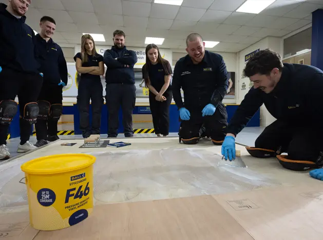 Floorsight F. Ball apprentices using F. Ball adhesives