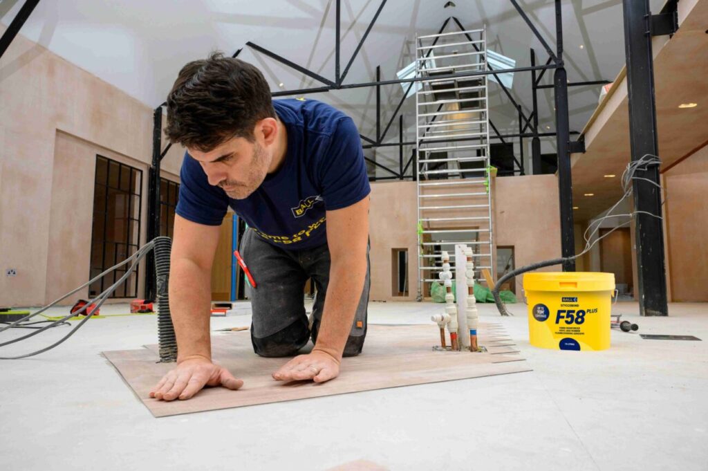 LVT flooring installation using F. Ball's Styccobond F58 PLUS flooring adhesive.