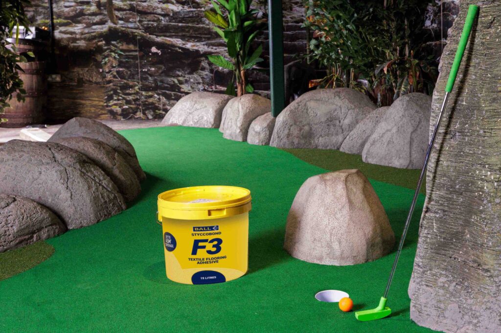 F. Ball's Styccobond F3 flooring adhesive used in a crazy golf flooring installation at Lost City Adventure Golf.